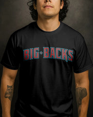 Person wearing a black t-shirt with 'BIG-BACKS' text in red and blue.