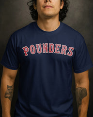 Person wearing a navy blue t-shirt with 'POUNDERS' printed in red.