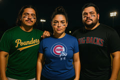 Three people wearing sports team-themed shirts in a dark outdoor setting.