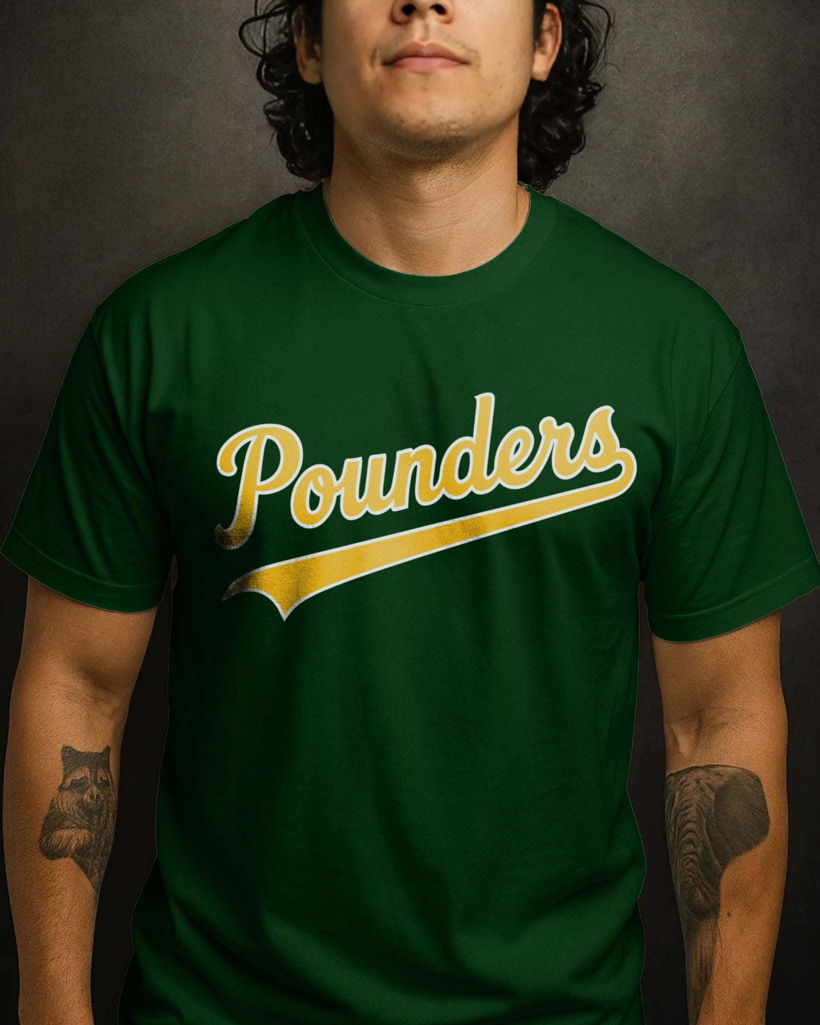 Person wearing a green t-shirt with 'Pounders' printed in yellow on a dark background